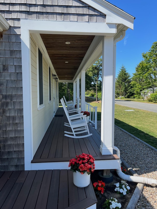 9 Country Ln, Dennis Port, MA 02639 - wooden porch featuring a yard