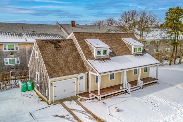 view of front of home with a porch and roof with shingles