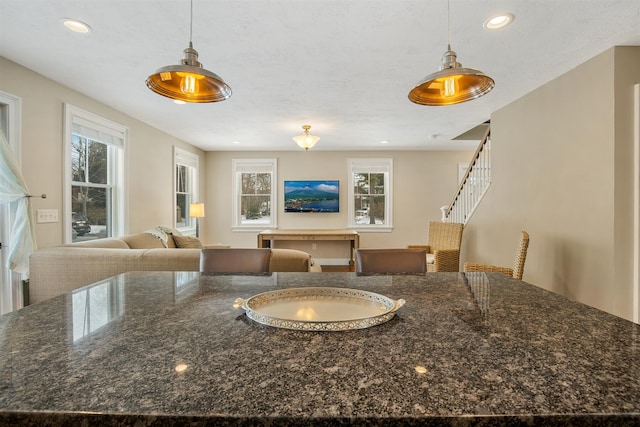 interior space with recessed lighting, plenty of natural light, and pendant lighting