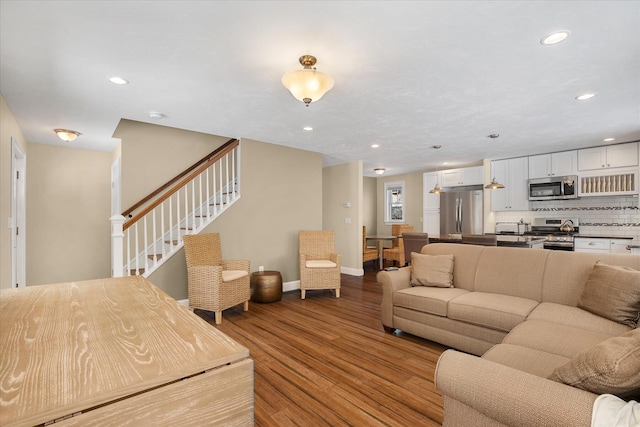 9 Country Ln, Dennis Port, MA 02639 - living room featuring wood finished floors, baseboards, recessed lighting, and stairs