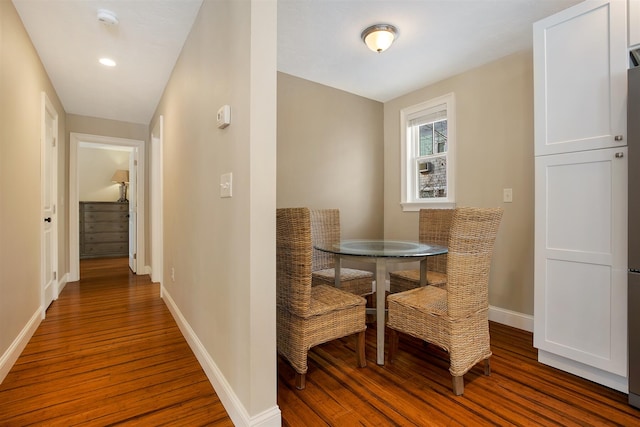 dining room with wood finished floors and baseboards