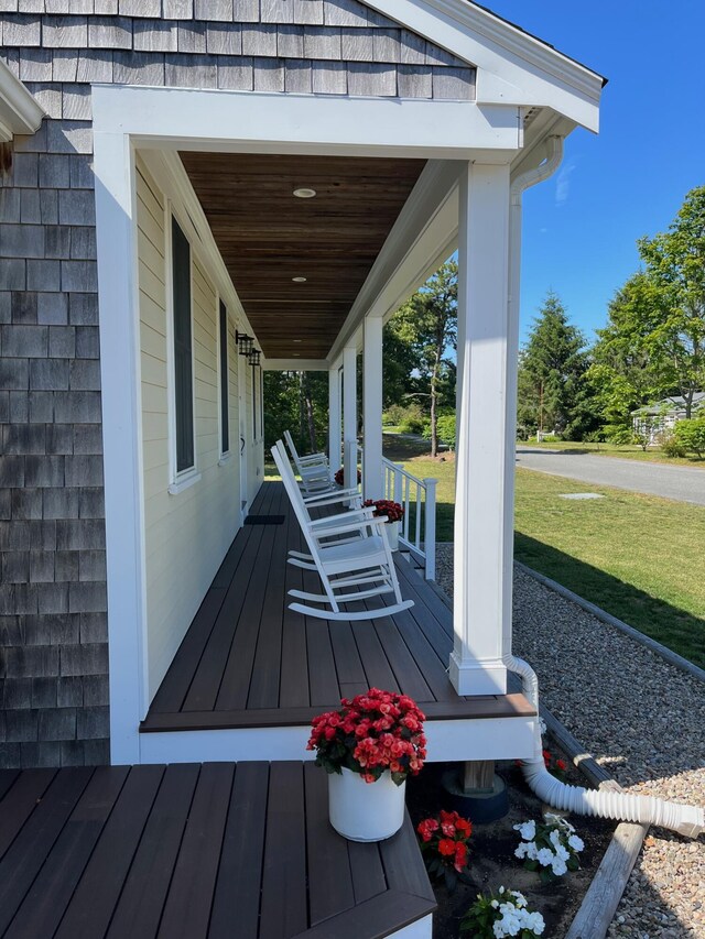 property entrance with roof with shingles