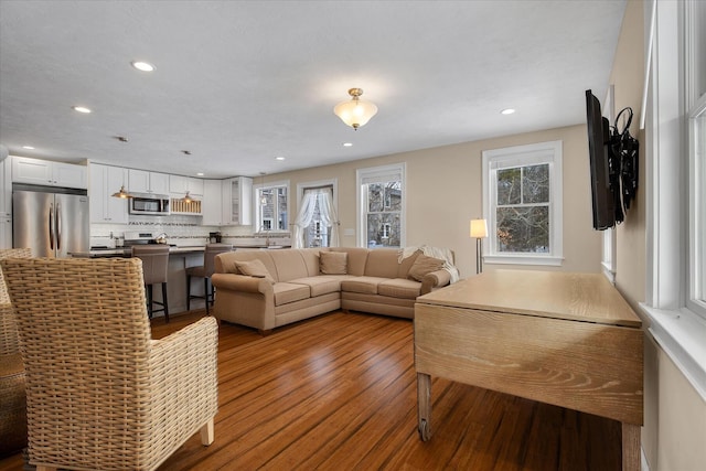 9 Country Ln, Dennis Port, MA 02639 - living area featuring wood finished floors and recessed lighting