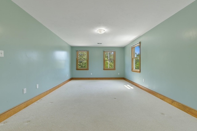 1311 Main St, Cotuit, MA 02635 - carpeted empty room with baseboards