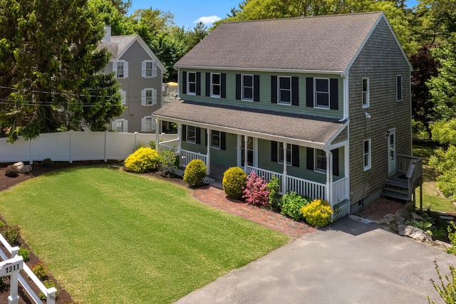 1311 Main St, Cotuit, MA 02635 - view of front of house featuring a shingled roof and covered porch