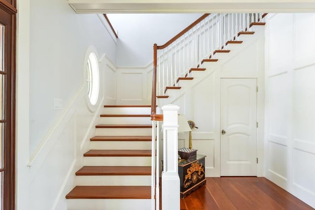 stairs with hardwood / wood-style flooring