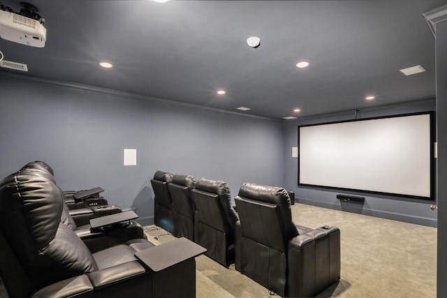 carpeted cinema room featuring ornamental molding