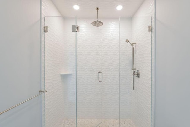 interior space with a shower with door