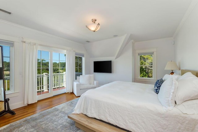 bedroom with access to exterior, ornamental molding, vaulted ceiling, and wood-type flooring