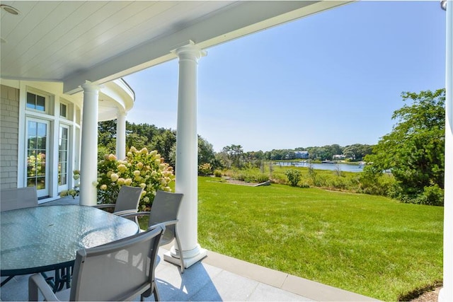 view of patio / terrace with a water view