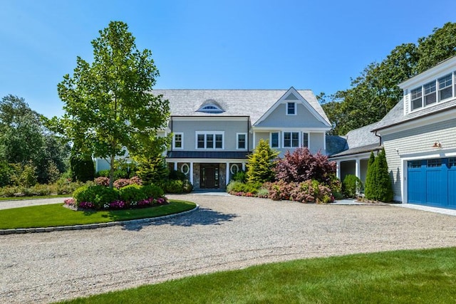 view of front facade featuring a garage and a front lawn