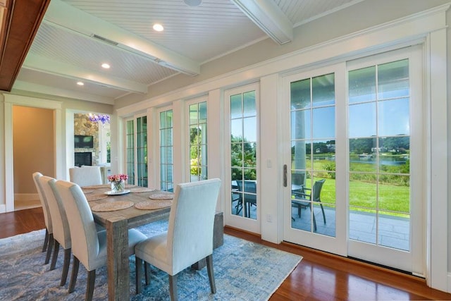 dining area with wood ceiling, beamed ceiling, and wood-type flooring