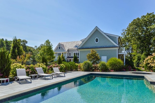 view of swimming pool featuring a patio area