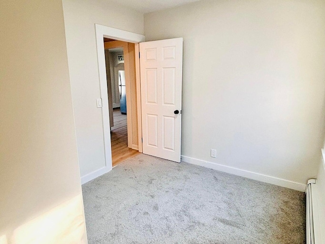 47 Harrison Ave, Buzzards Bay, MA 02532 - empty room with baseboard heating and light colored carpet