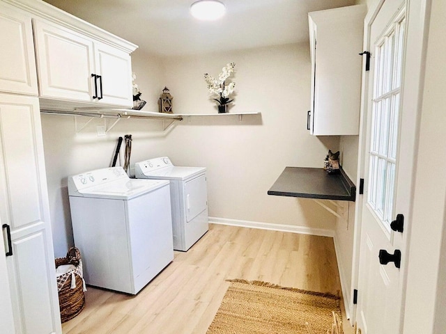 47 Harrison Ave, Buzzards Bay, MA 02532 - washroom with washing machine and dryer, cabinet space, and light wood-style floors