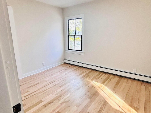 47 Harrison Ave, Buzzards Bay, MA 02532 - spare room featuring wood finished floors and a baseboard heating unit