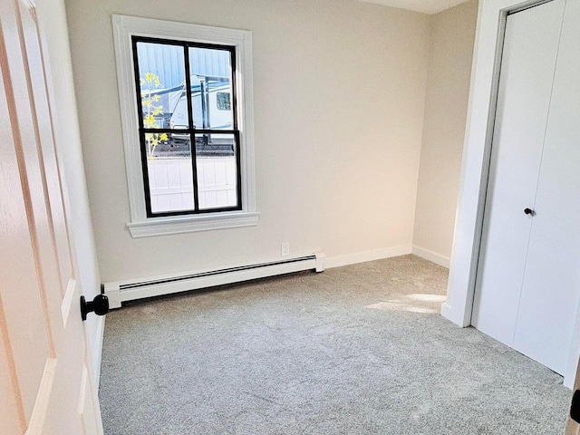 47 Harrison Ave, Buzzards Bay, MA 02532 - unfurnished bedroom featuring a baseboard radiator, carpet floors, and a closet