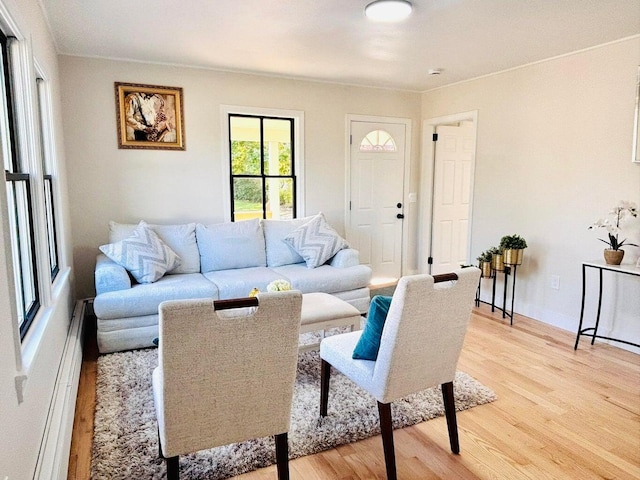 47 Harrison Ave, Buzzards Bay, MA 02532 - living room with baseboard heating, light wood-type flooring, and crown molding