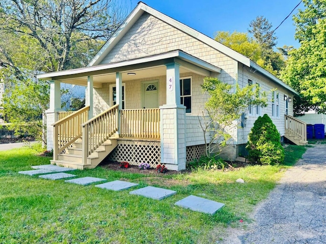 47 Harrison Ave, Buzzards Bay, MA 02532 - bungalow-style house with a porch, a front yard, and stairs