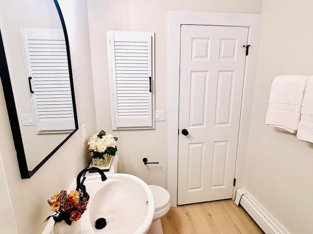 47 Harrison Ave, Buzzards Bay, MA 02532 - bathroom with a baseboard radiator and wood finished floors