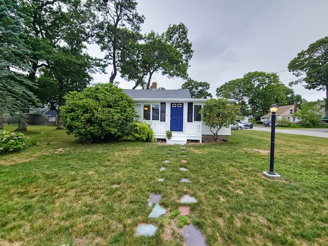 15 Fir St, Wareham, MA 02571 - view of front of home featuring a front yard, a chimney, and entry steps