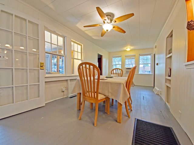 15 Fir St, Wareham, MA 02571 - dining space featuring hardwood / wood-style floors, built in features, a ceiling fan, and cooling unit
