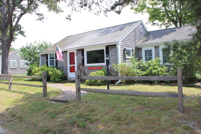 view of front of property with a front lawn