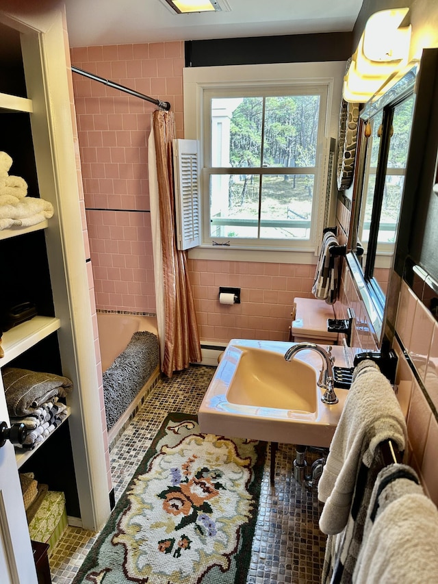 53 Highland Rd, North Truro, MA 02652 - full bath featuring shower / bath combo with shower curtain, a sink, and a baseboard heating unit