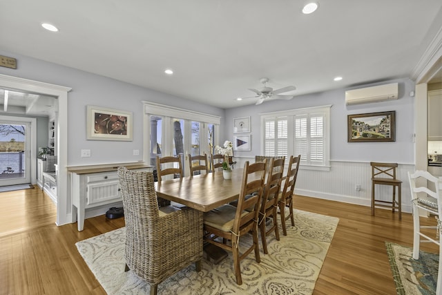 122 Point Of Pines Ave, Centerville, MA 02632 - dining room with a wainscoted wall, an AC wall unit, light wood-style floors, recessed lighting, and ceiling fan