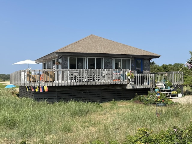 20 Beach Rd, Eastham, MA 02642 - rear view of property featuring a deck and roof with shingles