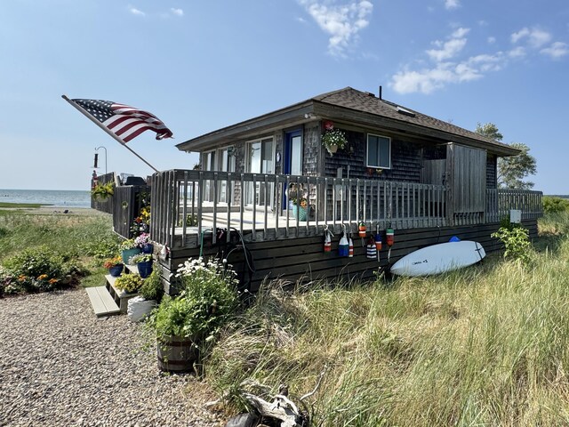 20 Beach Rd, Eastham, MA 02642 - view of front of property with a deck with water view