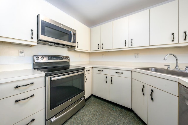 kitchen featuring a sink, light countertops, and stainless steel appliances