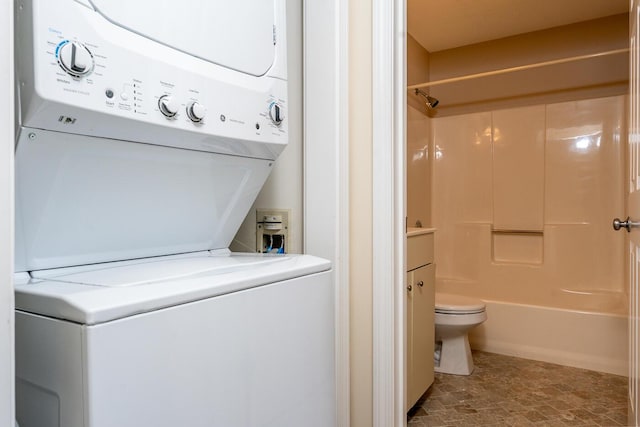washroom featuring laundry area and stacked washer and clothes dryer