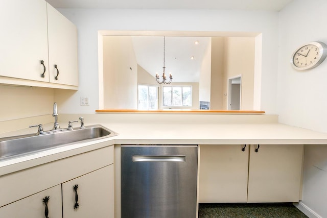 kitchen with a sink, light countertops, a chandelier, lofted ceiling, and stainless steel dishwasher
