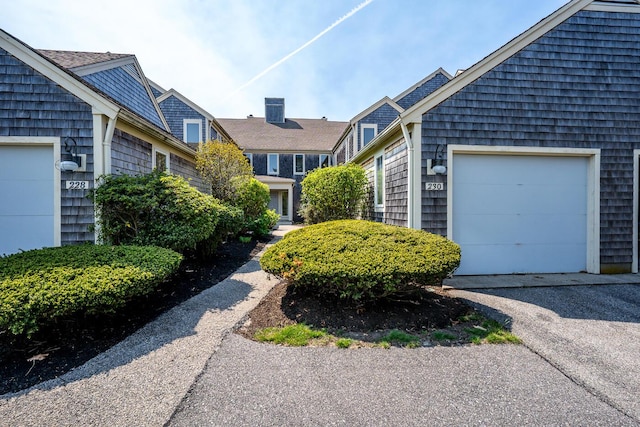 view of front of property with driveway and a garage