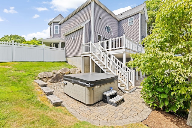 5 Bosuns Ln, Bourne, MA 02532 - rear view of house with a hot tub, a deck, stairs, and a patio area