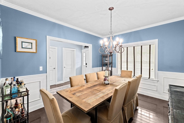 5 Bosuns Ln, Bourne, MA 02532 - dining area featuring a chandelier, wainscoting, ornamental molding, and dark wood-type flooring