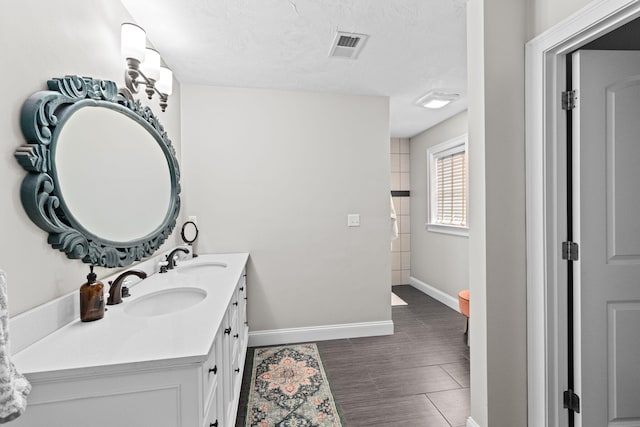 5 Bosuns Ln, Bourne, MA 02532 - bathroom with double vanity and baseboards