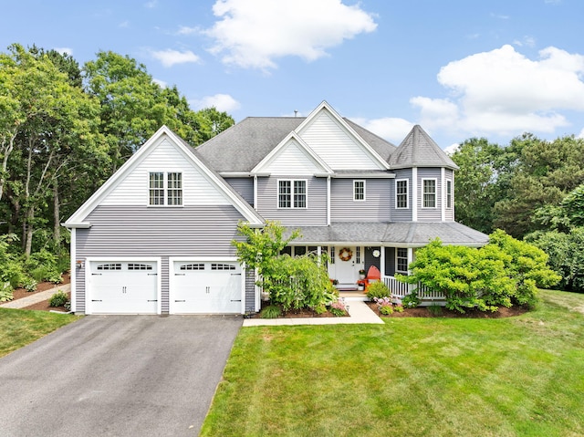 5 Bosuns Ln, Bourne, MA 02532 - view of front of home featuring a porch, driveway, a front yard, a garage, and a shingled roof