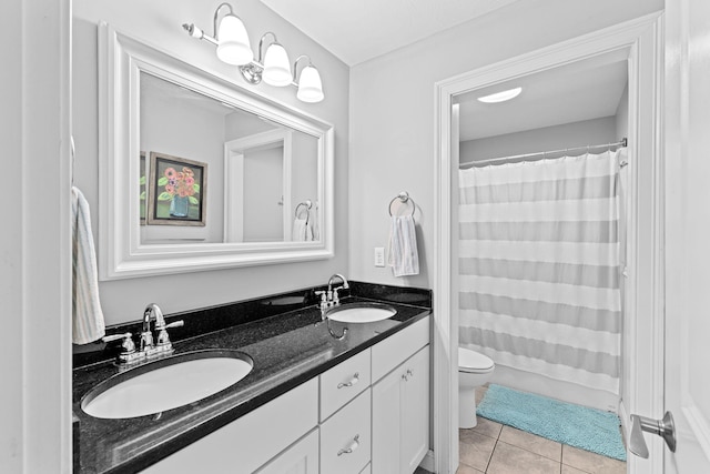 5 Bosuns Ln, Bourne, MA 02532 - bathroom with double vanity, tile patterned floors, and a shower with curtain