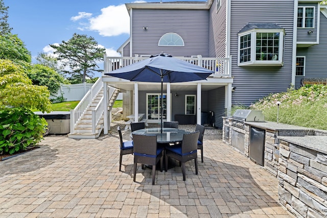 5 Bosuns Ln, Bourne, MA 02532 - view of patio / terrace with a hot tub, outdoor dining space, an outdoor kitchen, stairs, and a wooden deck