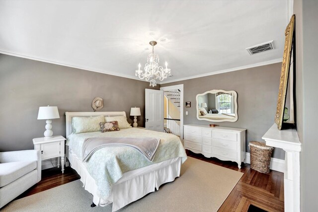 bedroom with dark wood-type flooring, ornamental molding, and a chandelier