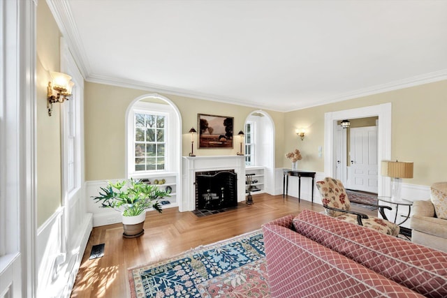 living room featuring crown molding and wood-type flooring