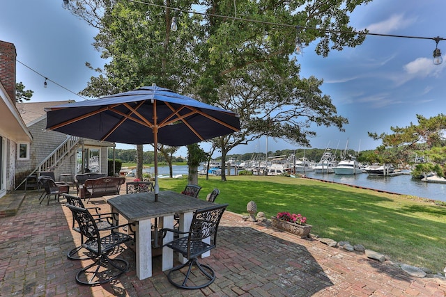 view of patio featuring a water view