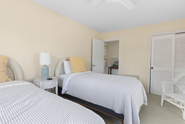 bedroom with carpet floors, a closet, and ceiling fan