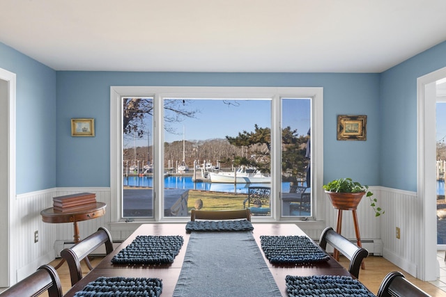 interior space with a water view and wood-type flooring