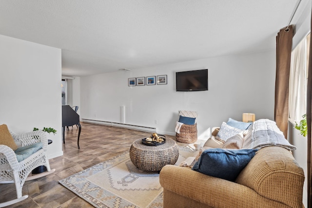 living room with baseboards and a baseboard heating unit