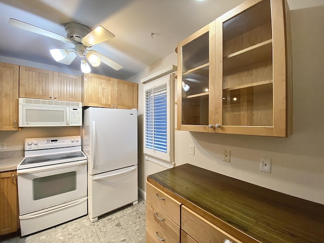 kitchen featuring ceiling fan and white appliances