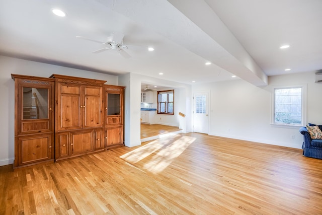 unfurnished living room with light wood-style floors, baseboards, and recessed lighting