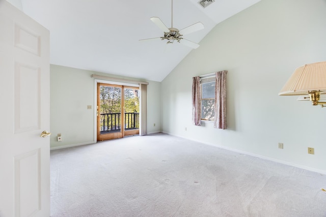 carpeted empty room with ceiling fan, baseboards, high vaulted ceiling, and visible vents